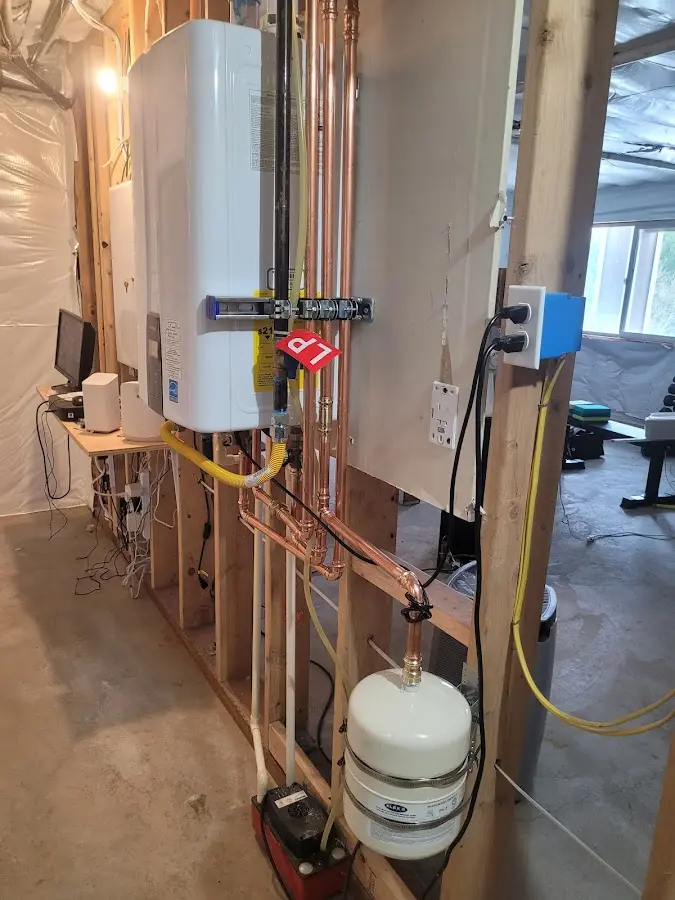 Licensed plumber repairing a kitchen sink in Minisink